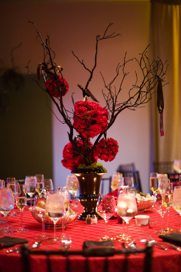 orange rose pomander centerpiece - wedding photo by Melissa Jill Photography